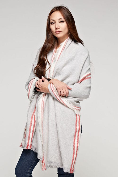 [Color: Grey/Berry] A brunette model wearing an oversized long grey scarf with a red striped border design