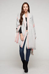 [Color: Grey/Berry] A brunette model wearing an oversized long grey scarf with a red striped border design