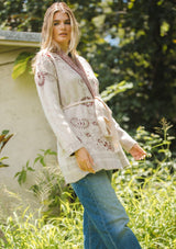 [Color: Natural/Burgundy] An ultra bohemian cardigan with a red and beige print. A cozy fall sweater with an open front, long sleeve, shawl collar, and an adjustable waist belt. Perfect for cooler temperatures and can be easily styled with denim jeans. 