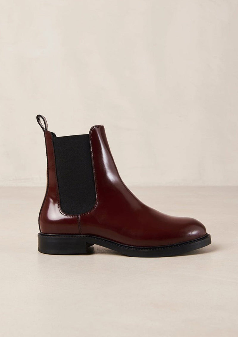 [Color: Burgundy] An elevated version of a classic chelsea boot crafted in red leather with a glossy finish. with elastic gores, thick rubber soles, and pull tab. A perfect trendy boot for the fall season. Designed by Alohas in Spain and Portugal.