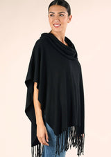 [Color: Black] A classic bohemian fringed sweater poncho with oversized cowl neckline. 