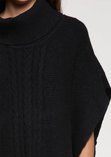 [Color: Black] A cable knit front tunic sweater poncho. 