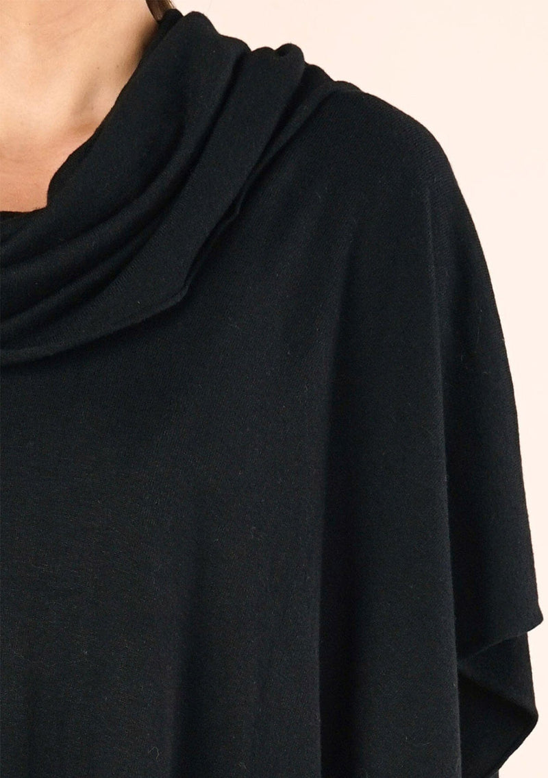 [Color: Black] A classic bohemian fringed sweater poncho with oversized cowl neckline. 