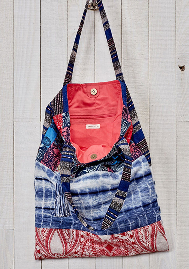 [Color: Blue Multi] A bohemian blue patchwork print tote bag with hanging tassel accent. 