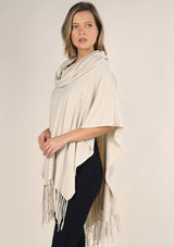 [Color: Bone] A classic bohemian fringed sweater poncho with oversized cowl neckline. 