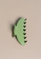 [Color: Pear] A two tone green medium sized hair clip by Nat and Noor. 