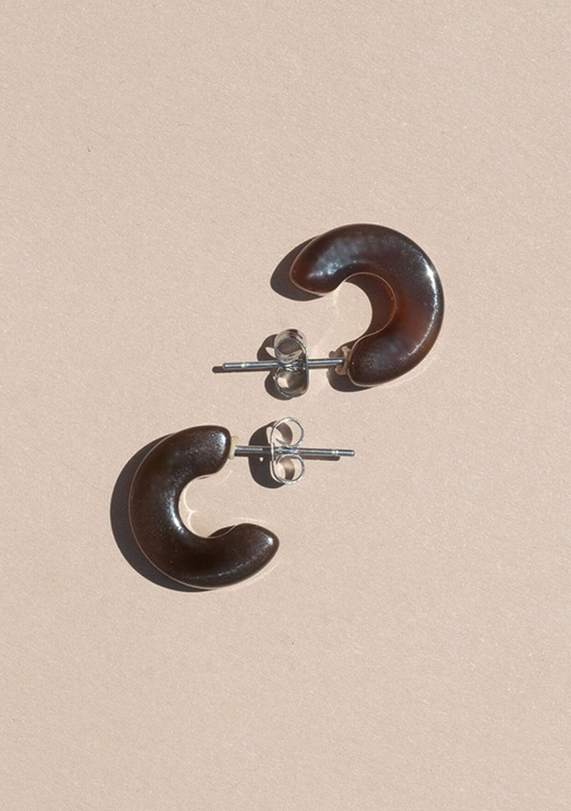 [Color: Espresso] A small dark brown acetate hoop earring. 