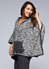 [Color: Black/Off White] A black and off white French terry hooded poncho. 