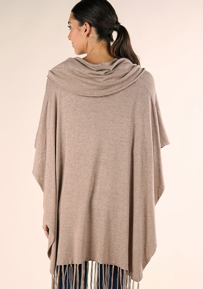 [Color: Heather Grain] A classic bohemian fringed sweater poncho with oversized cowl neckline. 