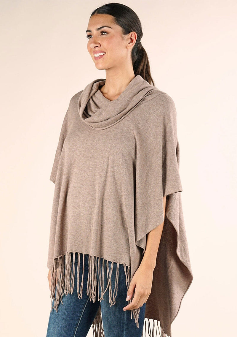 [Color: Heather Grain] A classic bohemian fringed sweater poncho with oversized cowl neckline. 