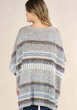 [Color: Grey/Blue] A lightweight bohemian sweater poncho pullover top in a mixed stripe. With short sleeves, a v neckline, and a relaxed fit. 