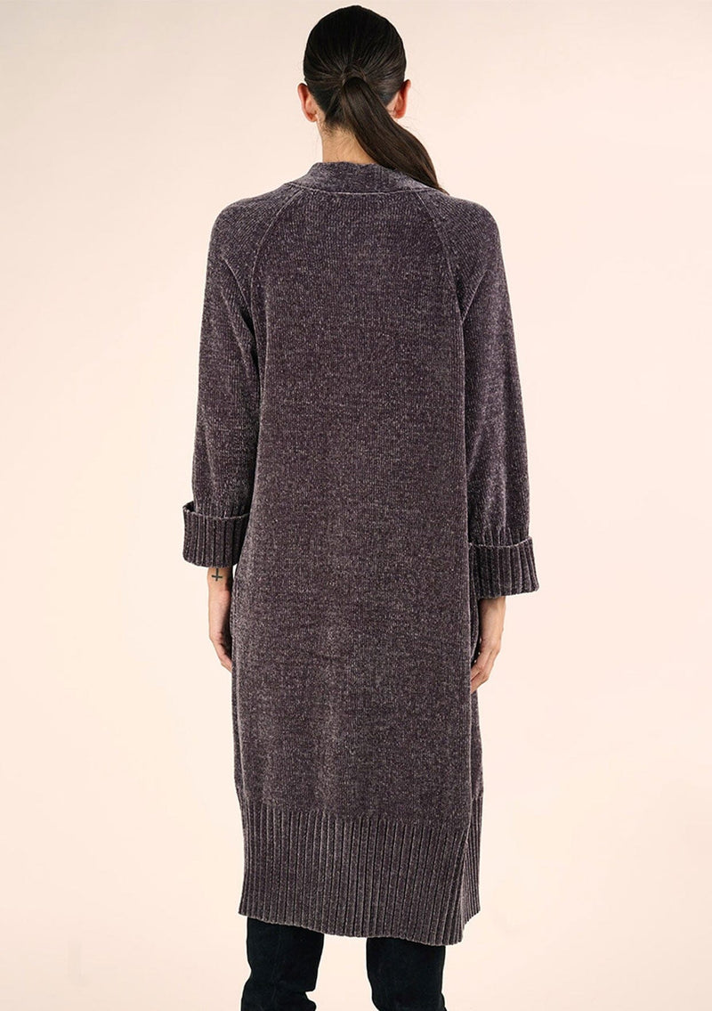 [Color: Charcoal] A back facing image of a brunette model wearing a soft grey chenille knit duster cardigan. With long sleeves, an open front, and side pockets. 