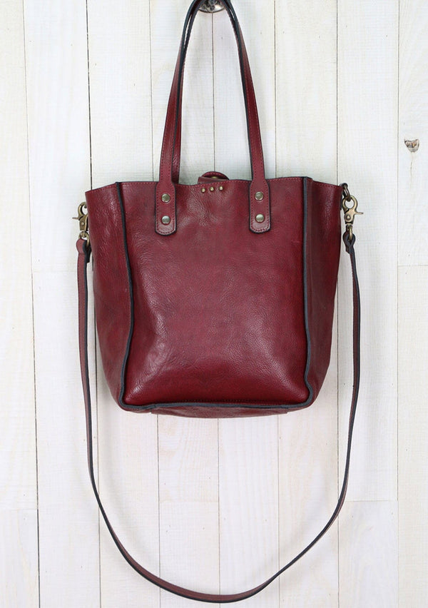 [Color: Mosto] Beautiful vintage style leather crossbody tote bag. With all the romance of an authentic vintage leather bag, our tote features subtle metal stud accents, a removable crossbody strap, and leather top handles.