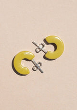 [Color: Guac] A small yellow green acetate hoop earring. 