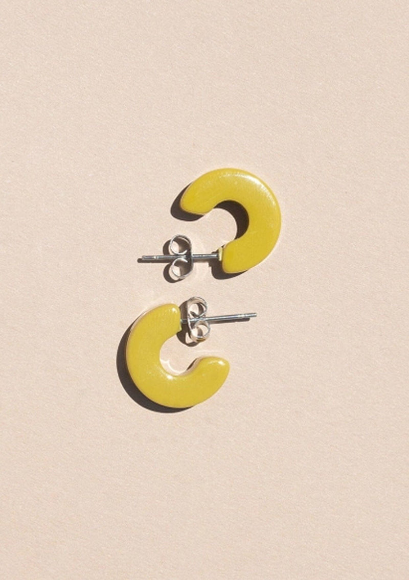 [Color: Guac] A small yellow green acetate hoop earring. 