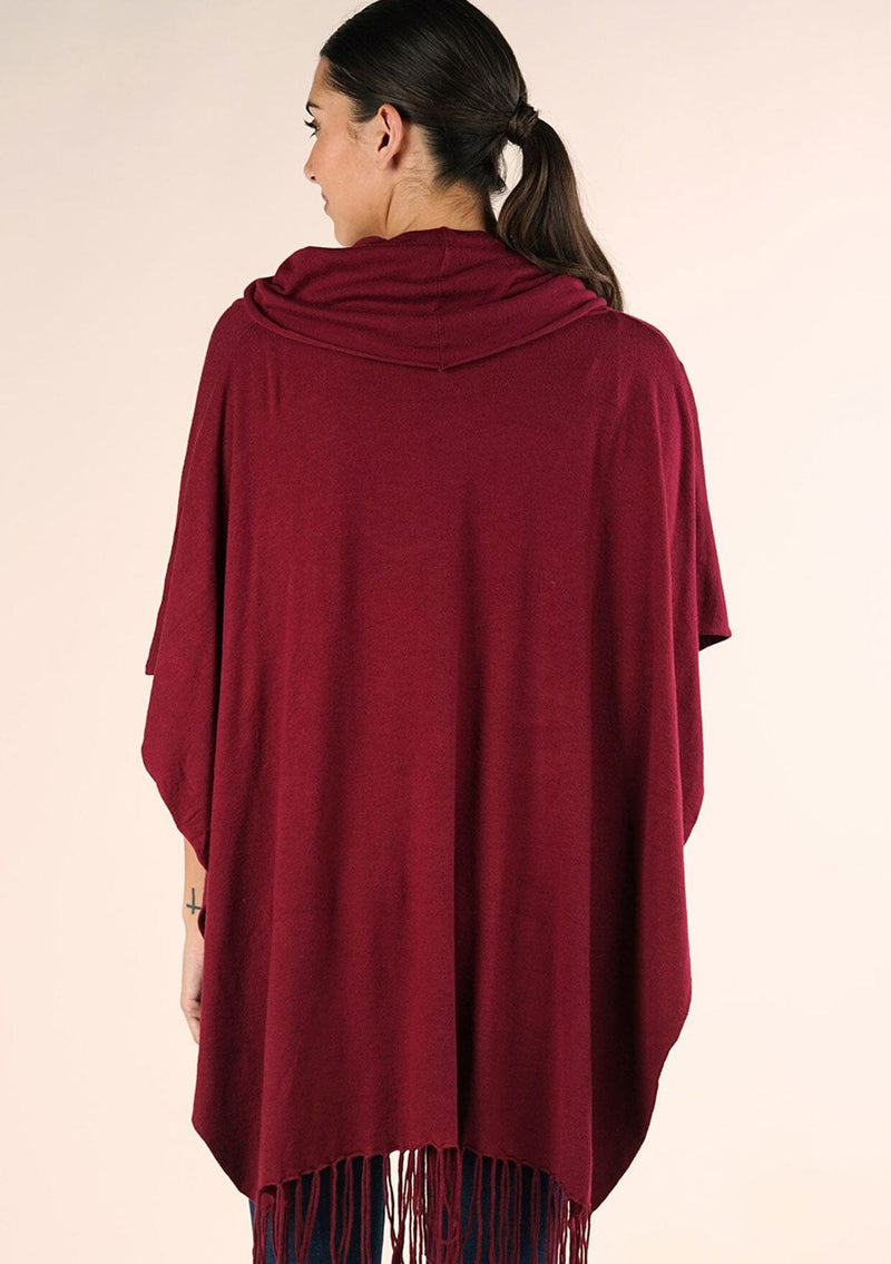 [Color: Merlot] A classic bohemian fringed sweater poncho with oversized cowl neckline. 