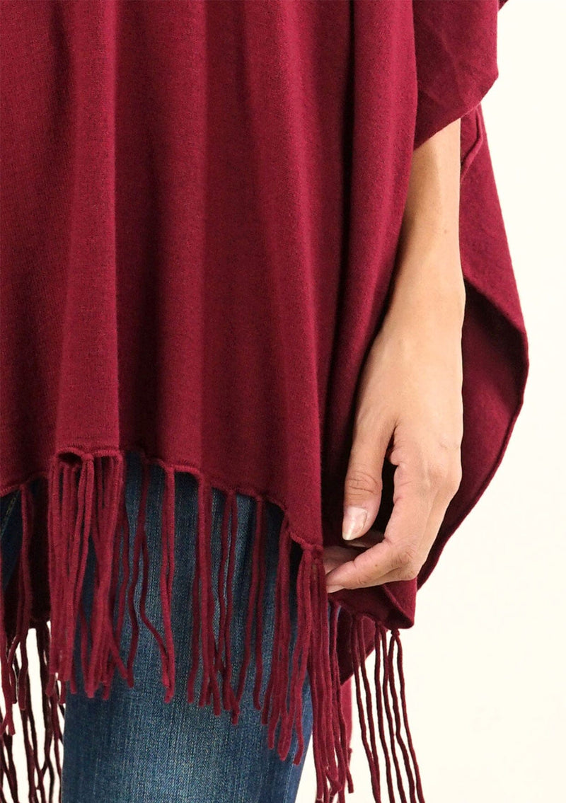 [Color: Merlot] A classic bohemian fringed sweater poncho with oversized cowl neckline. 