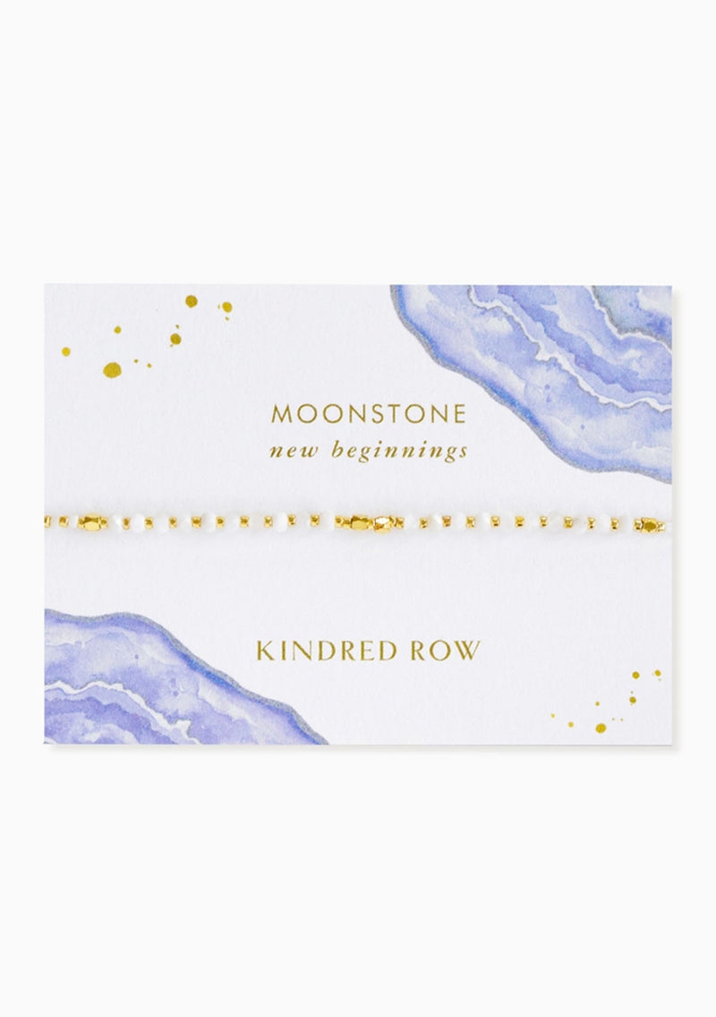 [Color: Moonstone] An adjustable healing bracelet, crafted on a durable nylon cord with gold-plated hardware and white natural gemstones. Designed by Kindred Row.