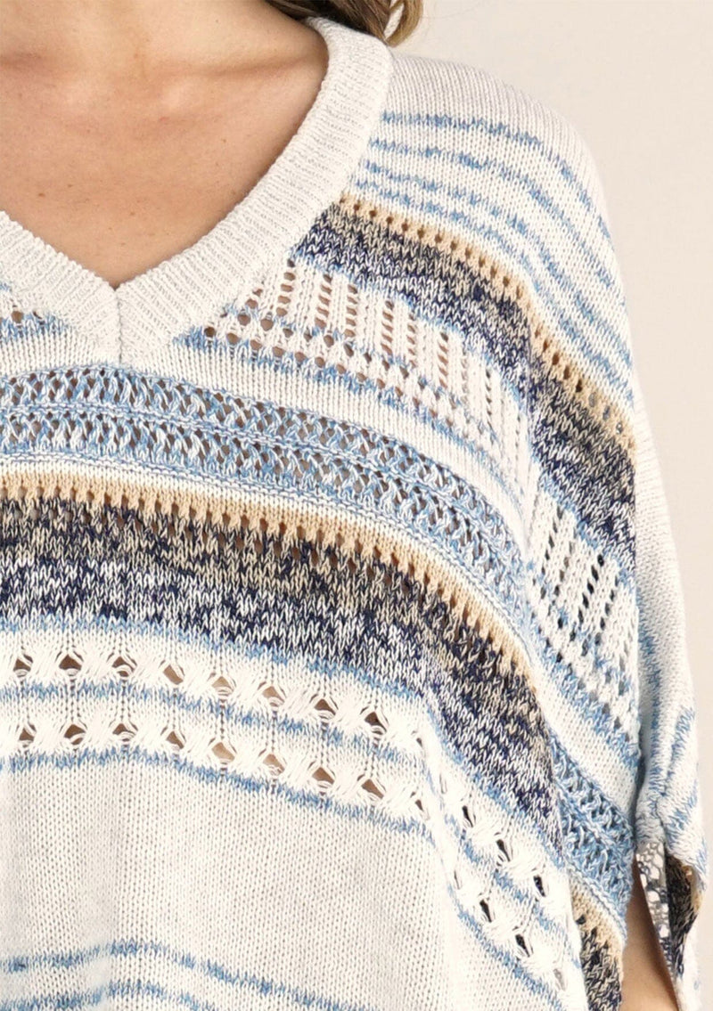 [Color: Oatmeal/Blue] A lightweight bohemian sweater poncho pullover top in a mixed stripe. With short sleeves, a v neckline, and a relaxed fit. 