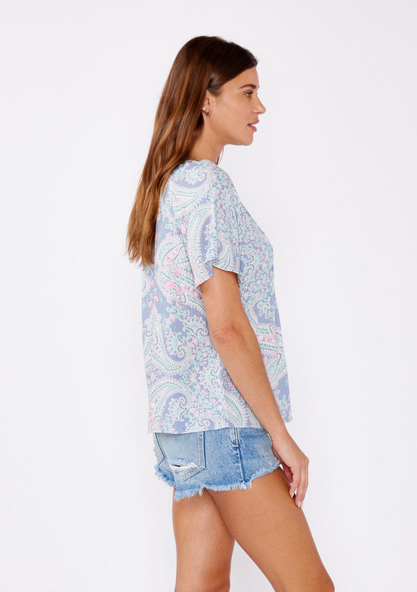 [Color: Periwinkle/Jade] Blue paisley print blouse adorned with pintuck details. This bohemian top features a split v neck, button front, and flowy short sleeves