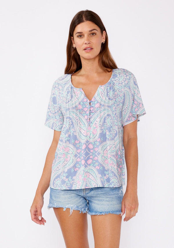 [Color: Periwinkle/Jade] Blue paisley print blouse adorned with pintuck details. This bohemian top features a split v neck, button front, and flowy short sleeves.  