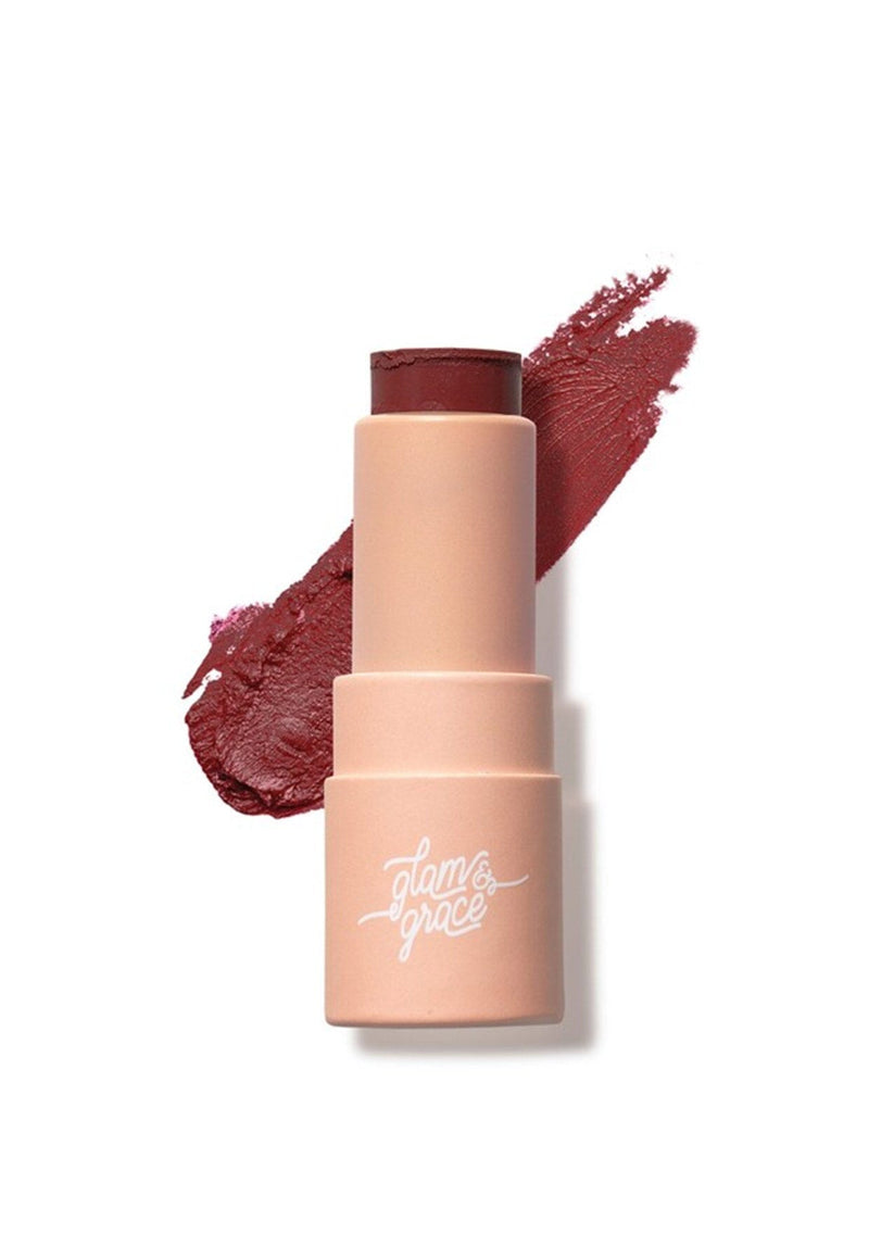 [Scent: Dark Raisin] A moisturizing semi-matte lip balm in a deep red shade, enriched with coconut oil for all-day comfort. Created by Glam & Grace.