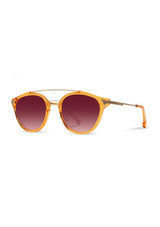 [Color: Tangerine] Clear Italian acetate sunglasses with contemporary round lens, metal brow bar, and wood accents. Orange frame accent with an ombre pink lenses. 