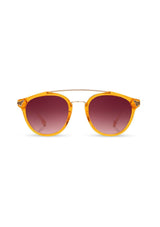 [Color: Tangerine] Clear Italian acetate sunglasses with contemporary round lens, metal brow bar, and wood accents. Orange frame accent with an ombre pink lenses. 