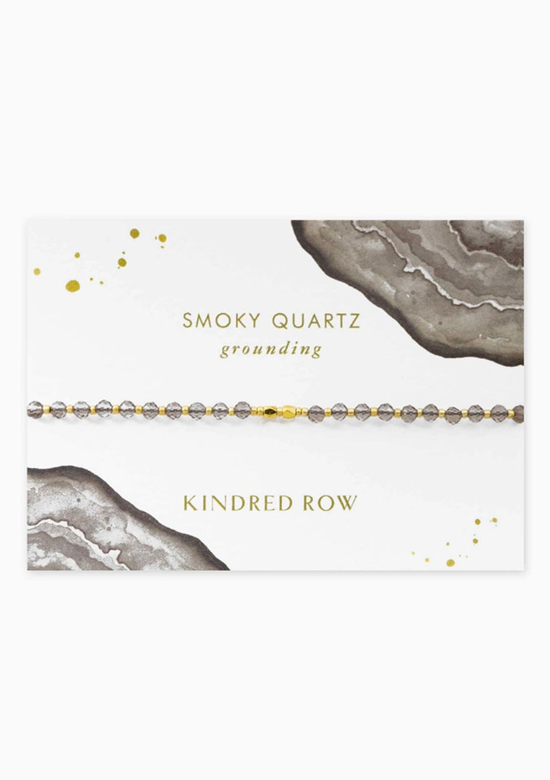 [Color: Smoky Quartz] An adjustable healing bracelet, crafted on a durable nylon cord with gold-plated hardware and colorless gemstones. Designed by Kindred Row