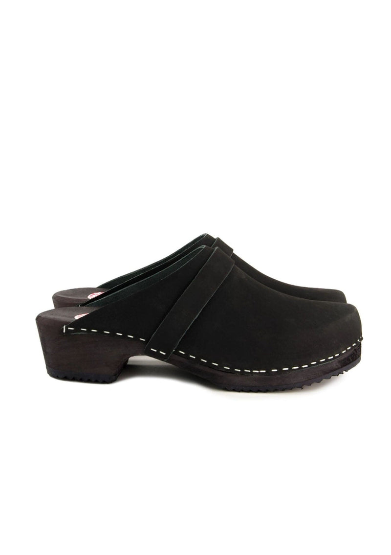 [Color: Black] A black leather classic clog with black strap and a wooden sole. Handmade in Sweden.