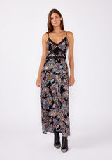 [Color: Black/Light Blue] A brunette model wearing a multi color floral print maxi dress with a flirty lace trim. An edgy bohemian maxi dress with a flattering v neckline, adjustable spaghetti straps, smocked back, and side slits. A sleeveless dress perfectly paired with boots or flats for the summer to fall season.