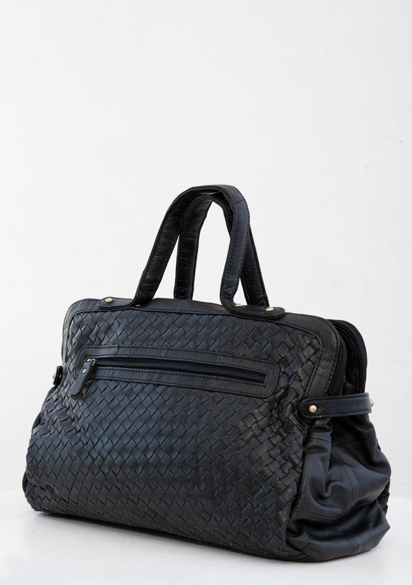 [Color: Black] A luxurious black woven leather bag. With two zippered compartments, a removable long leather crossbody strap, two leather top handles, and an exterior zippered pocket. 