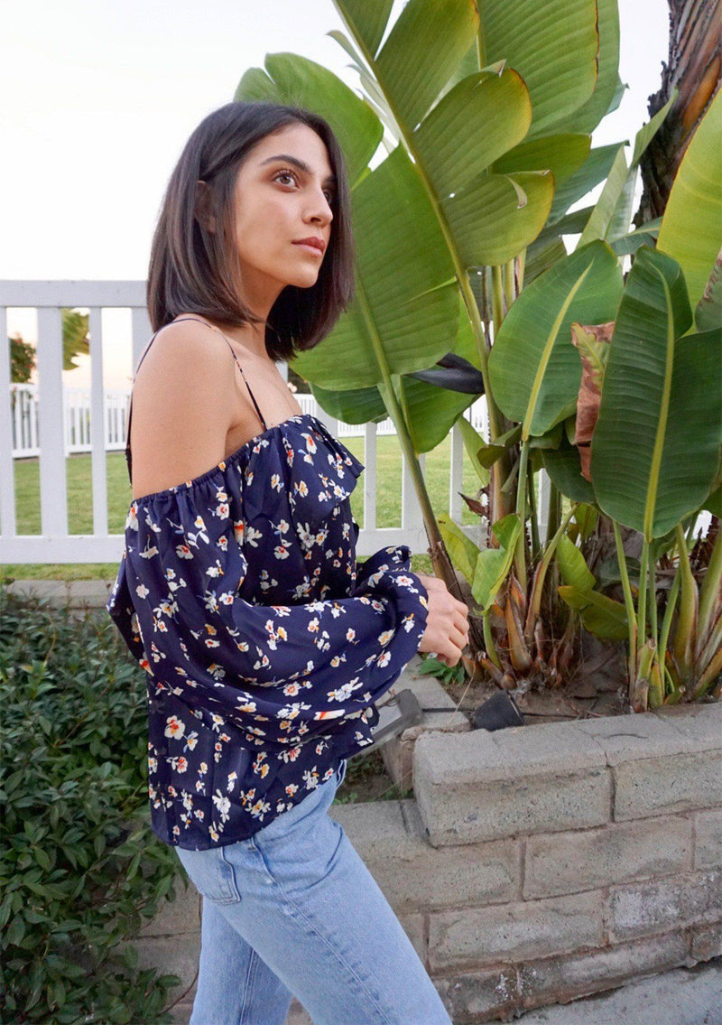 [Color: Midnight] A soft and silky bohemian cold shoulder top in a pretty small floral print. Featuring an off shoulder flounce detail, adjustable spaghetti straps, and flattering voluminous long sleeves. 