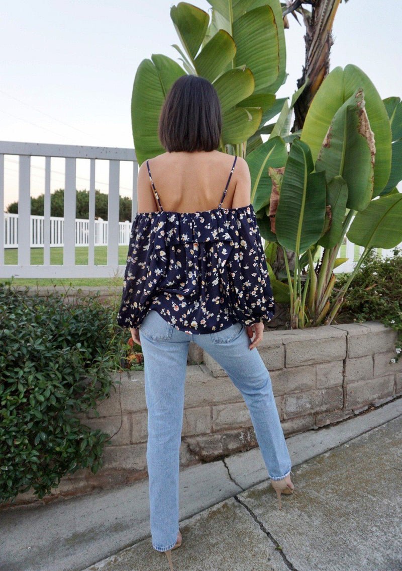 [Color: Midnight] A soft and silky bohemian cold shoulder top in a pretty small floral print. Featuring an off shoulder flounce detail, adjustable spaghetti straps, and flattering voluminous long sleeves. 