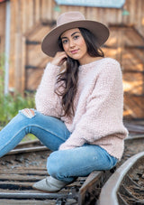 [Color: Petal] Our buttery soft fuzzy sweater features a versatile boat neckline and flattering long dolman sleeves. This cozy pullover is styled off shoulder with denim.