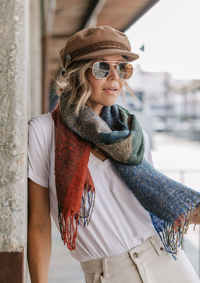 [Color: Multi] A multi color scarf featuring a fringe trim. 