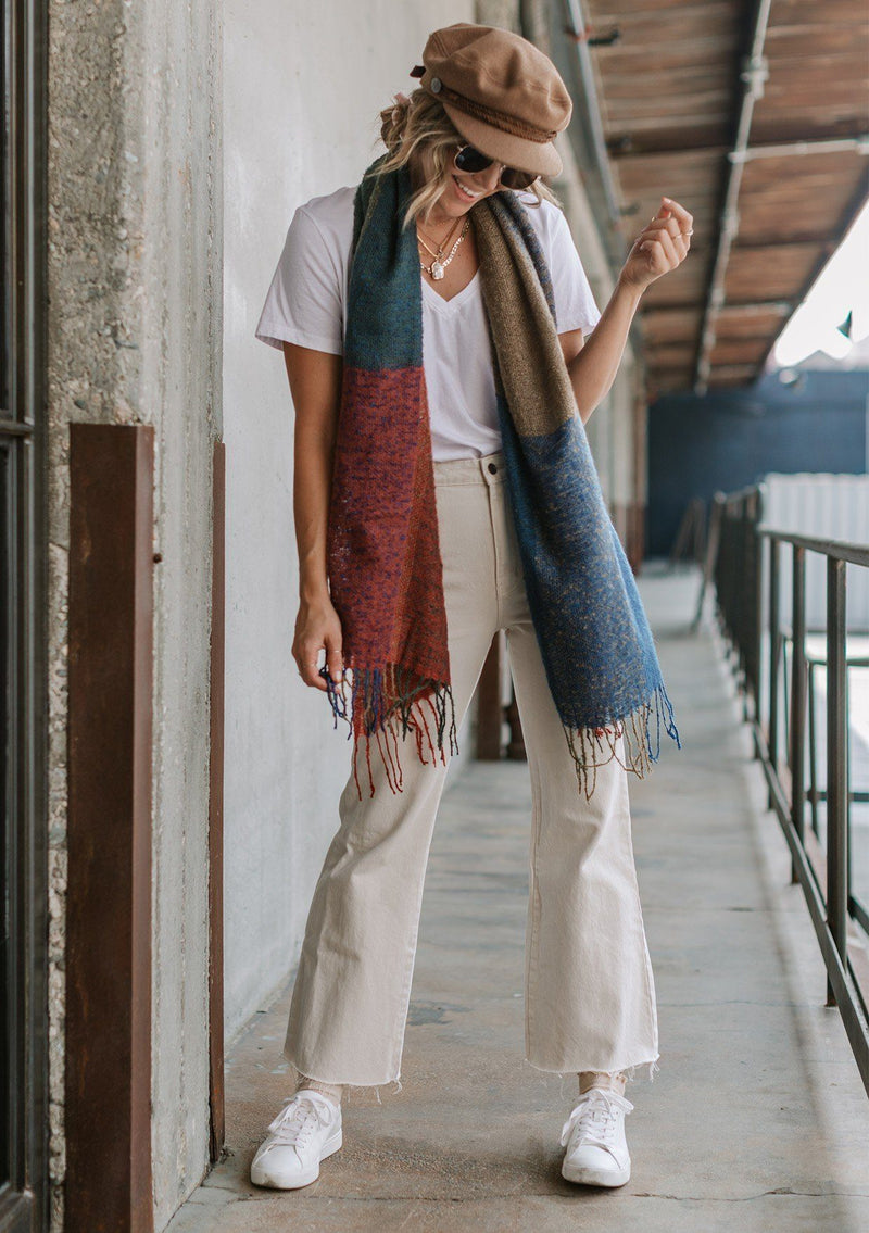 [Color: Multi] A multi color scarf featuring a fringe trim. 