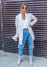 [Color: Winter White] A faux shearling coat in vegan suede. Featuring a cozy faux shearling interior and trim, a waist defining self tie belt, and essential side pockets. This timeless style is worn here with denim for a chic Fall look.