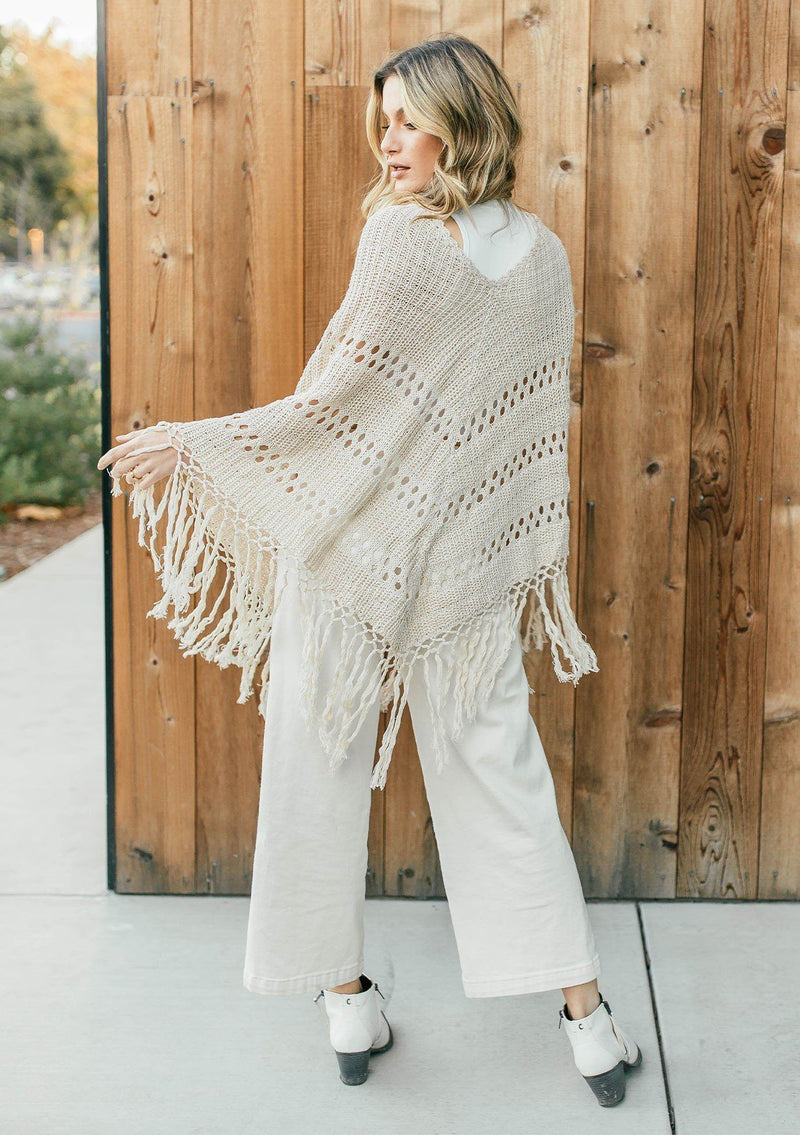 [Color: Vanilla]  An ultra bohemian crochet fringed off white poncho sweater.