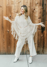 [Color: Vanilla]  An ultra bohemian crochet fringed off white poncho sweater.