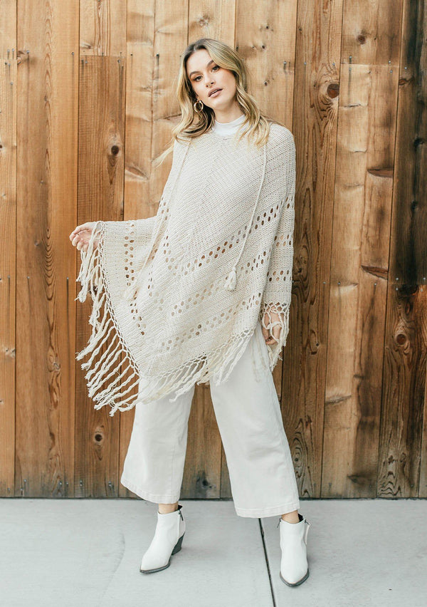 [Color: Vanilla]  An ultra bohemian crochet fringed off white poncho sweater.