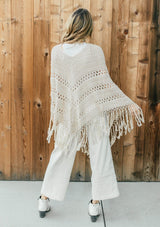 [Color: Vanilla]  An ultra bohemian crochet fringed off white poncho sweater.