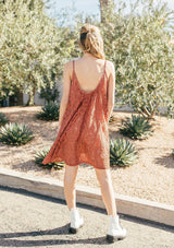 [Color: Spice] A sleeveless lace mini dress featuring a flattering scooped neckline and tent silhouette. 