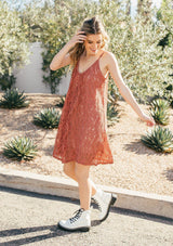 [Color: Spice] A sleeveless lace mini dress featuring a flattering scooped neckline and tent silhouette. 