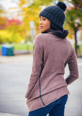 [Color: Mahogany] A cozy cardigan sweater, featuring essential side pockets and a chic vegan faux leather trim. 