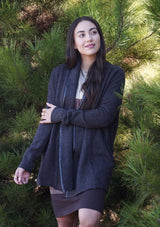 [Color: Charcoal] A cozy cardigan sweater, featuring essential side pockets and a chic vegan faux leather trim. 