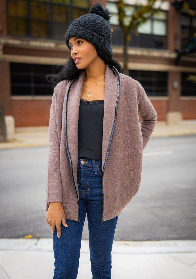 [Color: Mahogany] A cozy cardigan sweater, featuring essential side pockets and a chic vegan faux leather trim. 