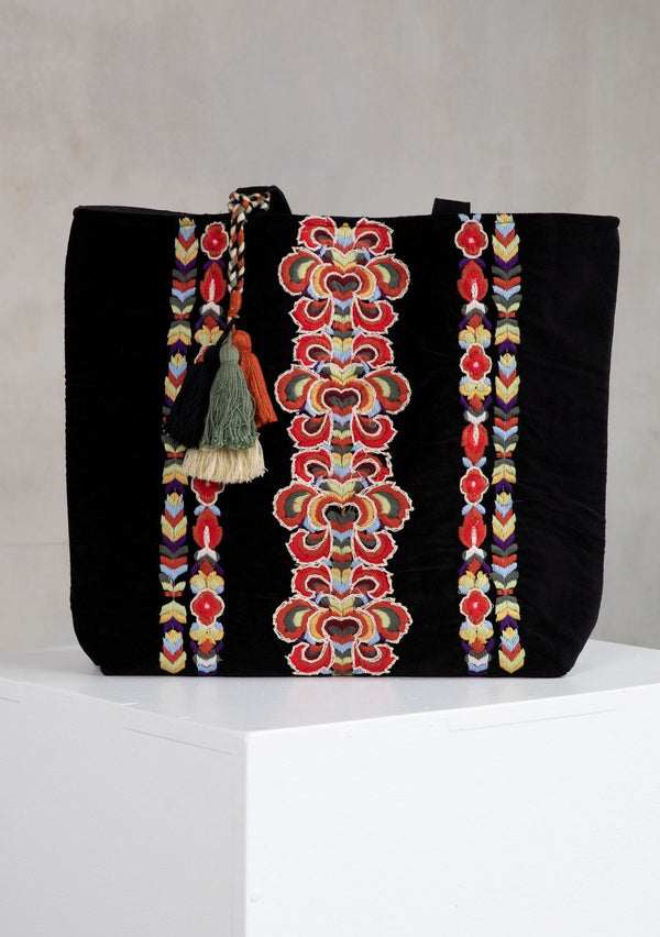 [Color: Black] A bohemian hand embroidered, black velvet tote bag with multi tassel drop detail, double leather strap handles, and large carry all size.