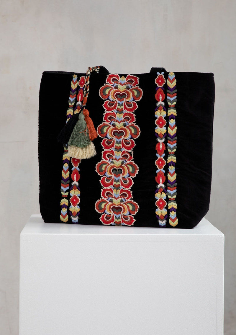 [Color: Black] A bohemian hand embroidered, black velvet tote bag with multi tassel drop detail, double leather strap handles, and large carry all size.