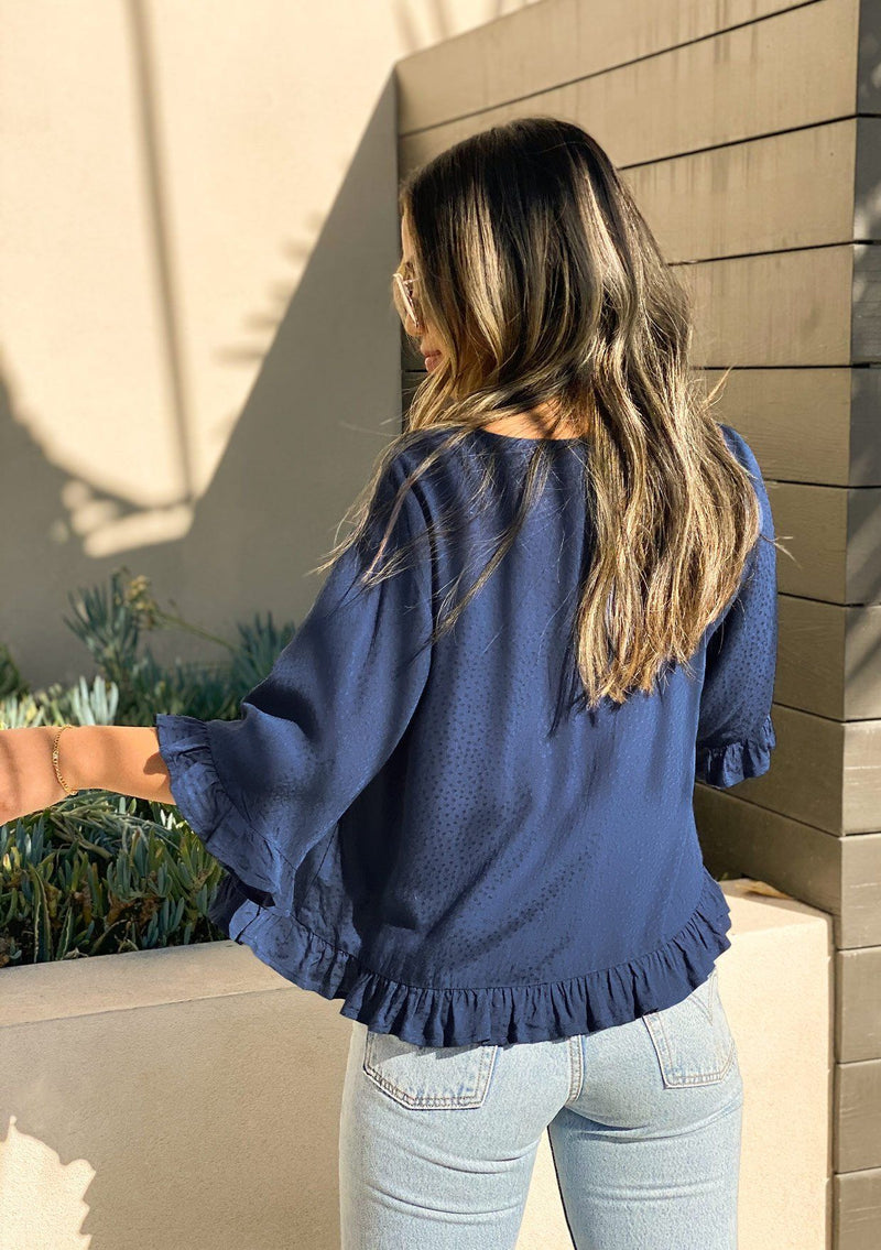 [Color: Dark Denim] Girl wearing a beautiful flowy cropped half sleeve ruffled blouse.